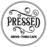 Circular Logo With “Pressed” In Large Ornate Letters And “Drive-Thru Cafe” In Block Text Below, Surrounded By A Double-Line Border With Decorative Swirls.