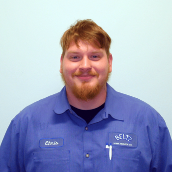 Chrisroehrig A Person In A Blue Work Shirt, Bearing A Name Tag Reading &Quot;Chris&Quot; And The Company Logo &Quot;Beltz Home Service Co.,&Quot; Stands Against A Light Background, Smiling Like A Proud Member Of The Team.